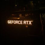 GeForce RTX backlighting on a graphics card lighting up in a dark room