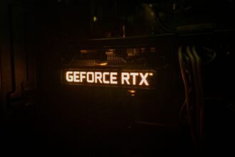 GeForce RTX backlighting on a graphics card lighting up in a dark room