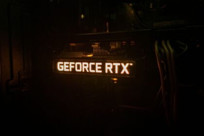 GeForce RTX backlighting on a graphics card lighting up in a dark room