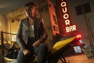 GTA 6 co-protagonist, Lucia Caminos, looks towards the camera on a yellow sports bike