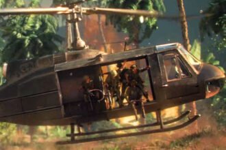 Hell Let Loose Vietnam post-launch update roadmap kicks off with two highly requested weapons and Hueys with radios - A group of soldiers prepares to disembark from a helicopter into the jungle.