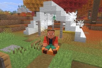 Minecraft Snapshot 9: a person made from blocks sits inder a tent in the woods.