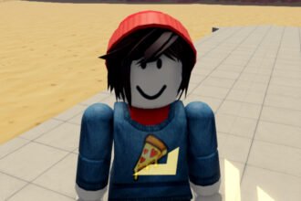 Military Army Tycoon codes: A Roblox character in a red beanie and pizza shirt standing on a tycoon plot in the desert