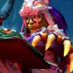 World of Warcraft Midnight patch notes for October 6, 2026 - An Orc makes notes in a large tome using a quill, in the latest update to the Blizzard MMORPG.